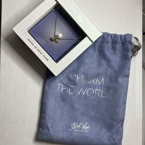 Silver charm necklace with extension. “J” charm and heart charm included.